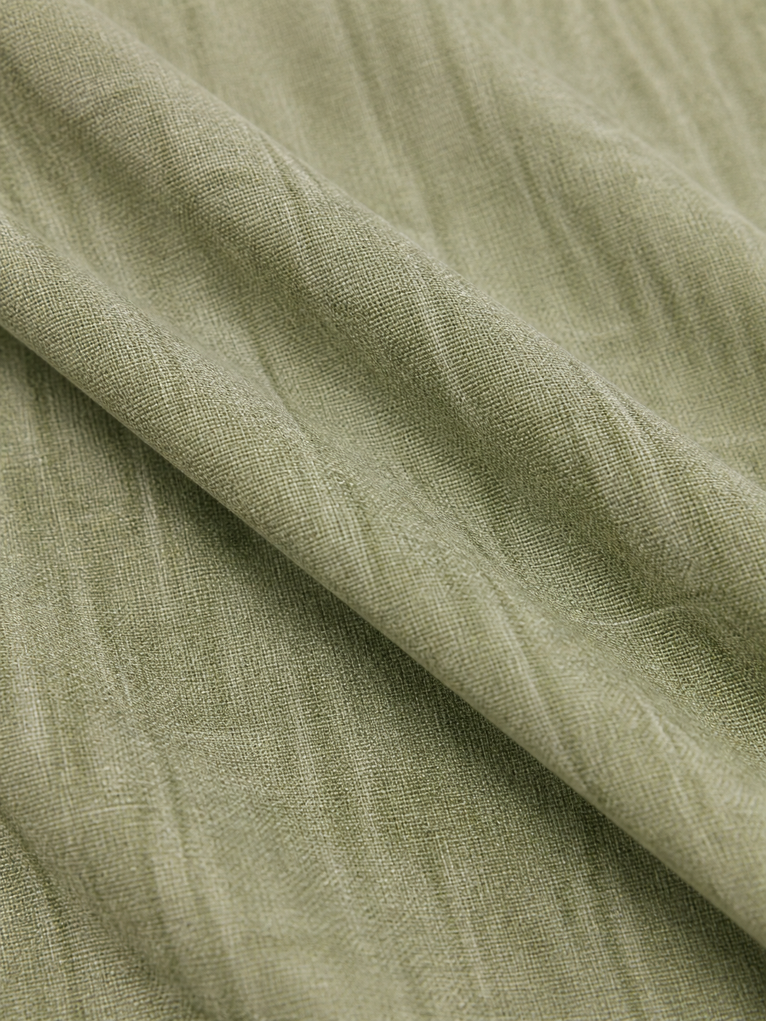 Texture du tissu vert sauge de la Robe Emery